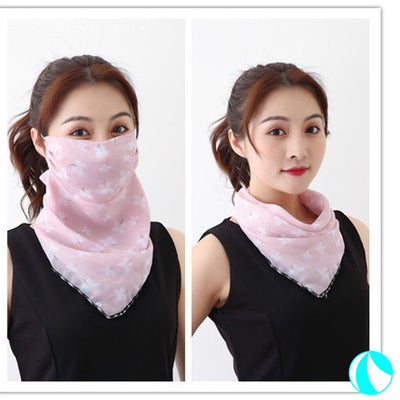 White women's UV protection scarf with black speckle pattern, worn as a face mask and neck scarf. - Image 7