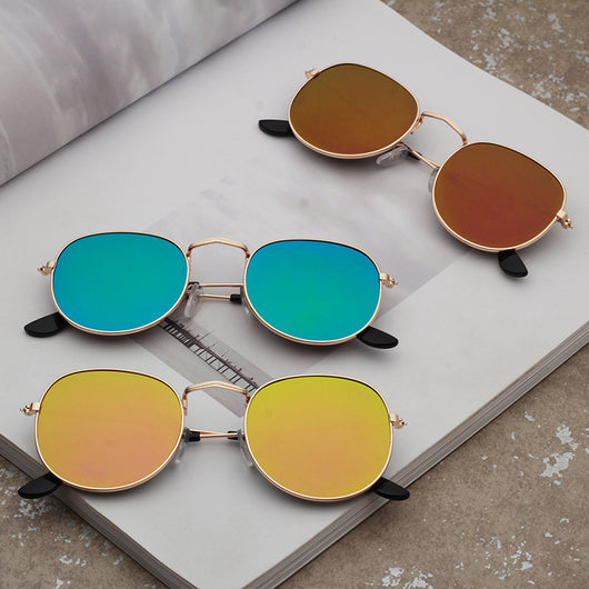 Round metallic sunglasses with iridescent green and gold lenses and a gold-colored metal frame. - Image 18
