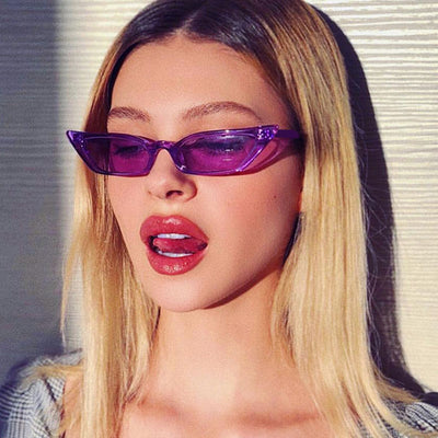 Narrow cat-eye sunglasses with a transparent yellow frame and yellow tinted lenses on a white background. - Image 11