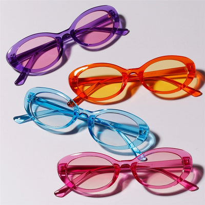 Translucent blue small frame oval sunglasses with light blue lenses on a white background. - Image 4