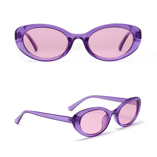Translucent blue small frame oval sunglasses with light blue lenses on a white background. - Image 8