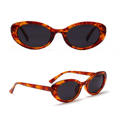 Translucent blue small frame oval sunglasses with light blue lenses on a white background. - Image 11