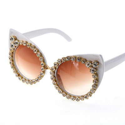 White cat-eye sunglasses with brown gradient lenses, adorned with clear and amber rhinestone flowers and bees. - Image 9