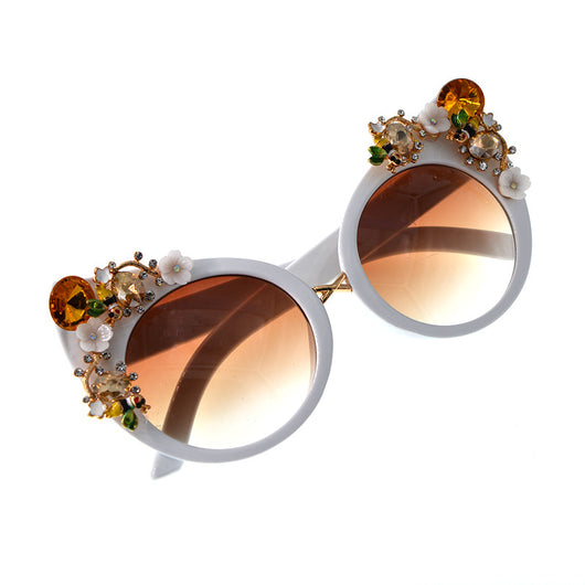 White cat-eye sunglasses with brown gradient lenses, adorned with clear and amber rhinestone flowers and bees. - Image 10