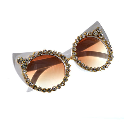 White cat-eye sunglasses with brown gradient lenses, adorned with clear and amber rhinestone flowers and bees. - Image 11