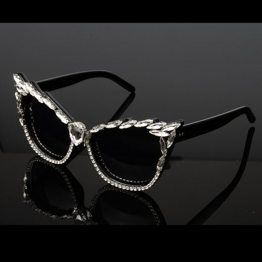 Black cat-eye sunglasses with clear rhinestones along the frames and a large teardrop rhinestone at the bridge. - Image 5