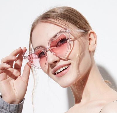Heart-shaped tortoiseshell sunglasses with light brown lenses on a white background, perfect for women. - Image 7