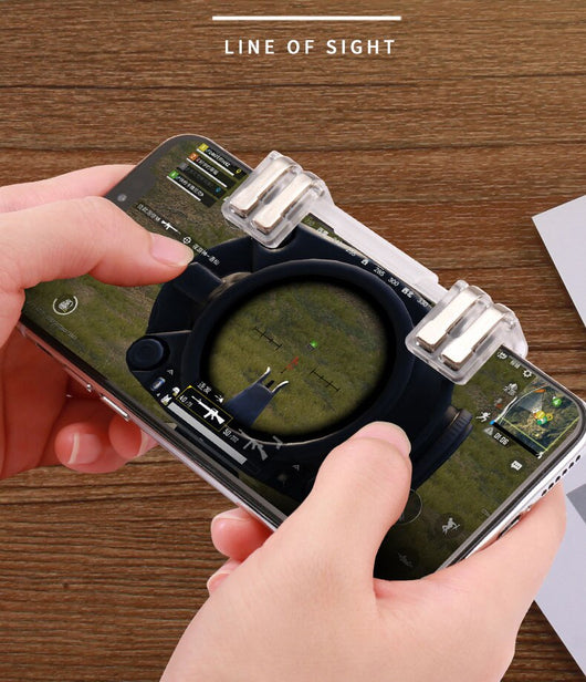 Transparent six-finger telescopic gaming trigger attached to a smartphone displaying a battle royale game. - Image 14