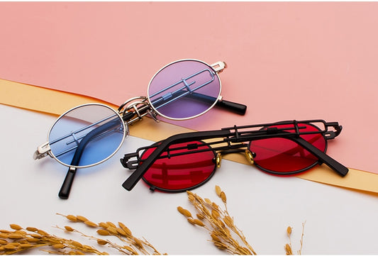 Black individual steampunk sunglasses with round clear lenses and unique metal frames on a white background. - Image 2