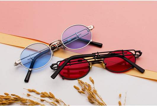 Black individual steampunk sunglasses with round clear lenses and unique metal frames on a white background. - Image 2