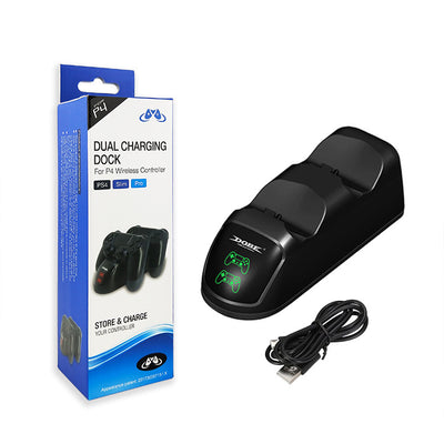 Black dual charging dock for PS4 wireless controllers with green LED indicators, shown with its retail box and USB cable. - Image 6