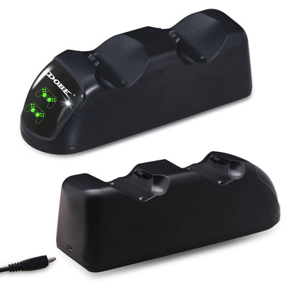 Black dual charging dock for PS4 wireless controllers with green LED indicators, shown with its retail box and USB cable. - Image 9