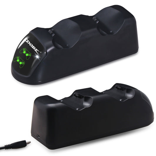 Black dual charging dock for PS4 wireless controllers with green LED indicators, shown with its retail box and USB cable. - Image 9