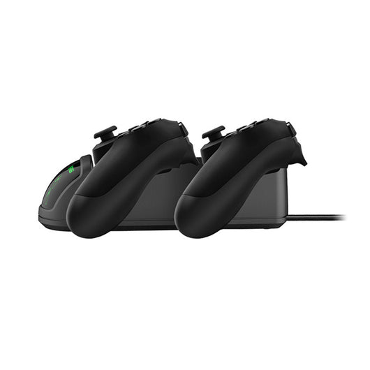 Black dual charging dock for PS4 wireless controllers with green LED indicators, shown with its retail box and USB cable. - Image 12