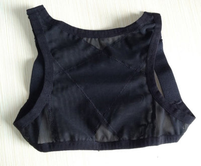 Woman wearing a black posture correction belt with criss-cross back design over a grey shirt, adjusting the strap. - Image 5