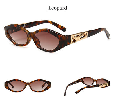 Angular cat-eye sunglasses with a tortoiseshell frame, brown gradient lenses, and gold jumping cheetah temple details. - Image 27