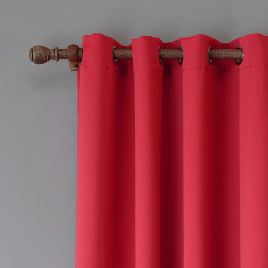 Red Oxford cloth curtain with metal grommets hanging on a decorative wooden rod against a gray wall. - Image 8