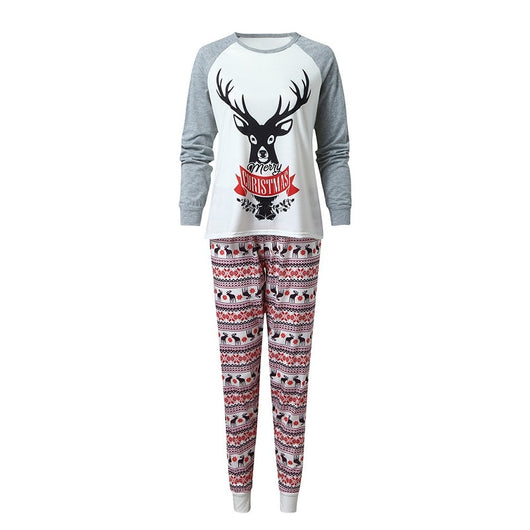 Young boy wearing a Christmas pajama set with a white and grey raglan top featuring a reindeer and fair isle print pants. - Image 11