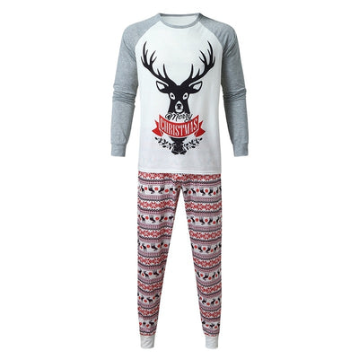 Young boy wearing a Christmas pajama set with a white and grey raglan top featuring a reindeer and fair isle print pants. - Image 14