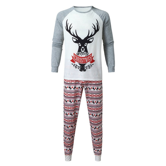 Young boy wearing a Christmas pajama set with a white and grey raglan top featuring a reindeer and fair isle print pants. - Image 14