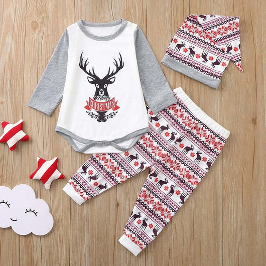 Young boy wearing a Christmas pajama set with a white and grey raglan top featuring a reindeer and fair isle print pants. - Image 21