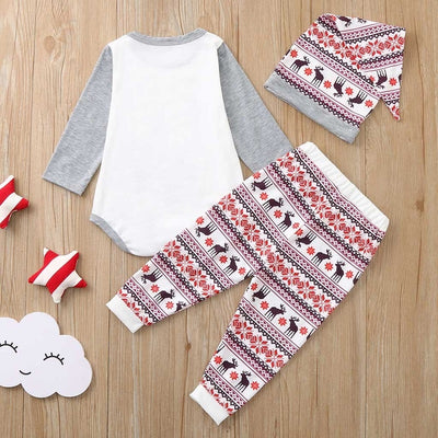 Young boy wearing a Christmas pajama set with a white and grey raglan top featuring a reindeer and fair isle print pants. - Image 22