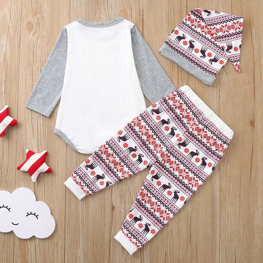 Young boy wearing a Christmas pajama set with a white and grey raglan top featuring a reindeer and fair isle print pants. - Image 22