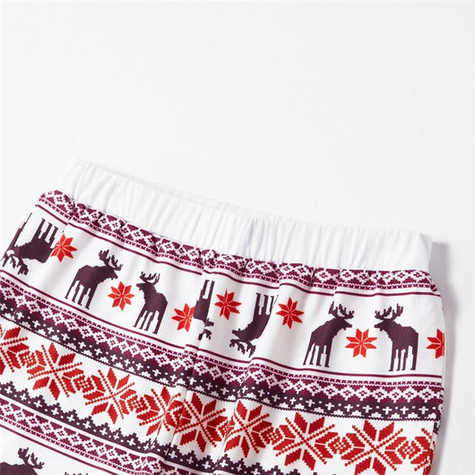 Young boy wearing a Christmas pajama set with a white and grey raglan top featuring a reindeer and fair isle print pants. - Image 27