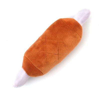 Purple plush eggplant pet toy with a green stem and an embroidered happy face, designed for dogs and cats. - Image 37