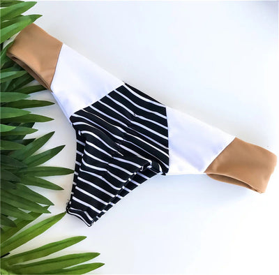 Striped printed split triangle female swimsuit with bandeau top and color block bottom on white background. - Image 6