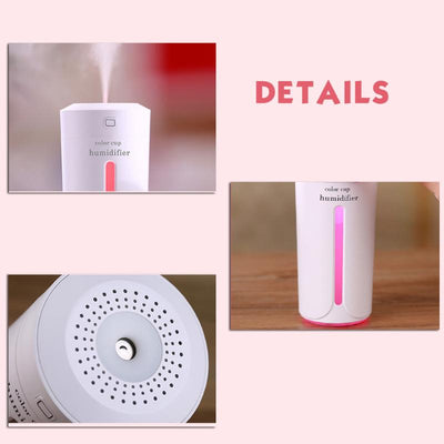 White mini USB ultrasonic humidifier with a green LED light strip, emitting mist, on a white surface. - Image 12