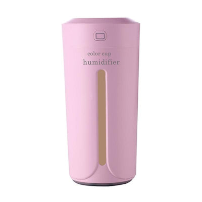 White mini USB ultrasonic humidifier with a green LED light strip, emitting mist, on a white surface. - Image 21