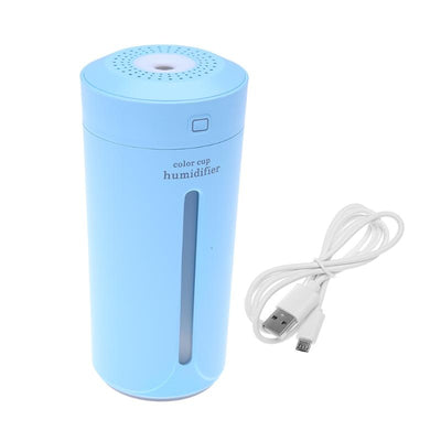 White mini USB ultrasonic humidifier with a green LED light strip, emitting mist, on a white surface. - Image 23