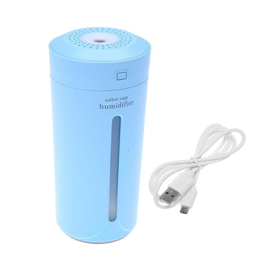 White mini USB ultrasonic humidifier with a green LED light strip, emitting mist, on a white surface. - Image 23