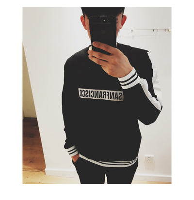 Black sweater suit with white stripes on sleeves and hem, featuring mirrored "SAN FRANCISCO" text on the chest. - Image 16
