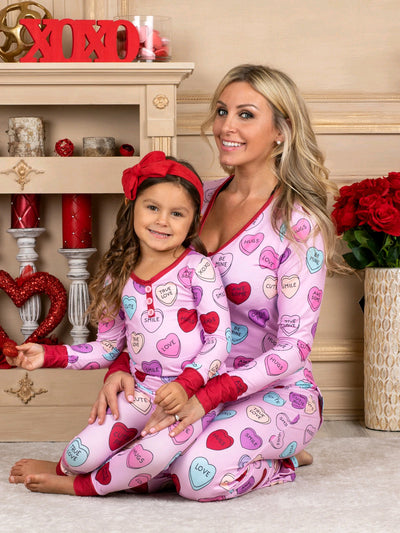 Pink long-sleeve pajama set with a conversation heart print, red Henley neckline, and matching full-length pants. - Image 13