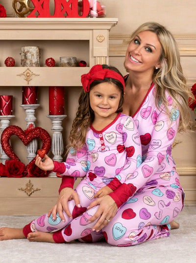 Pink long-sleeve pajama set with a conversation heart print, red Henley neckline, and matching full-length pants. - Image 14