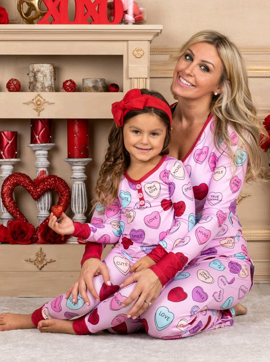 Pink long-sleeve pajama set with a conversation heart print, red Henley neckline, and matching full-length pants. - Image 14