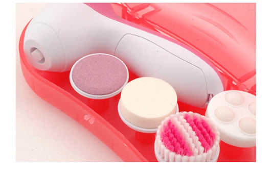 White electric facial cleanser with multiple brush and sponge attachments in an open translucent teal carrying case. - Image 16