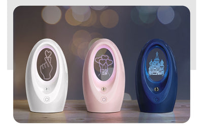 Navy blue USB humidifier with an oval shape and an illuminated castle design in the center. - Image 11