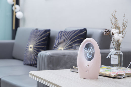 Navy blue USB humidifier with an oval shape and an illuminated castle design in the center. - Image 16