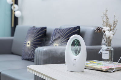 Navy blue USB humidifier with an oval shape and an illuminated castle design in the center. - Image 18
