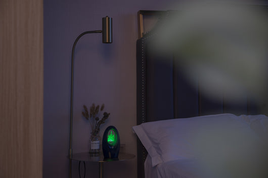 Navy blue USB humidifier with an oval shape and an illuminated castle design in the center. - Image 19