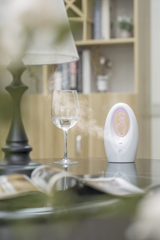 Navy blue USB humidifier with an oval shape and an illuminated castle design in the center. - Image 20