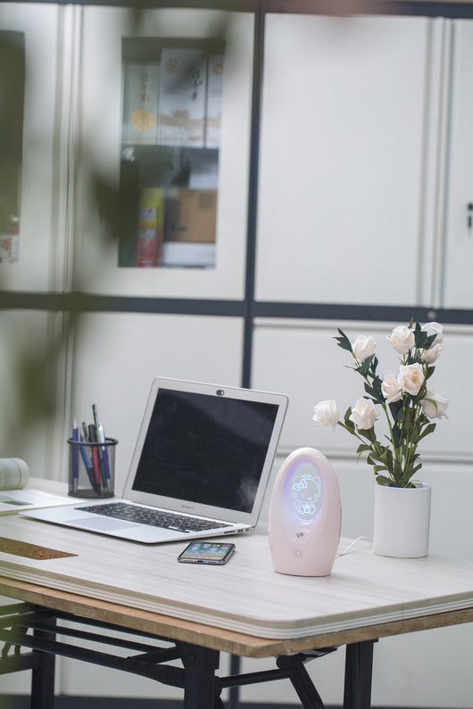 Navy blue USB humidifier with an oval shape and an illuminated castle design in the center. - Image 21