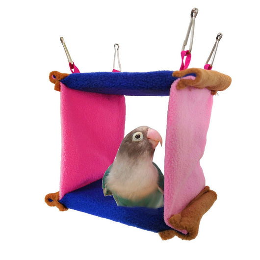 Colorful blue and pink fleece bird hammock nest with a small bird peeking out, hanging by metal clips. - Image 13