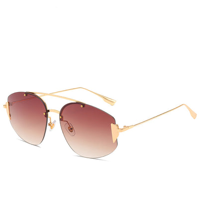 Women's fashion rimless sunglasses with blue to yellow gradient lenses and a gold-colored metal frame. - Image 4