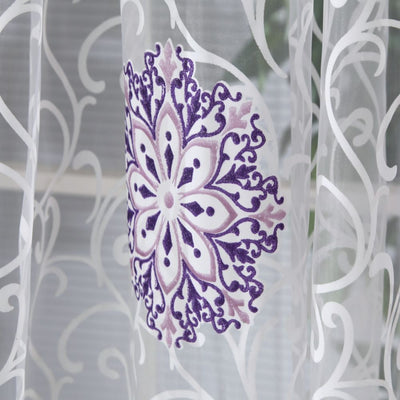 Sheer white European-style floral curtain with brown and gold patterns, hung on a gold rod in a bedroom. - Image 13