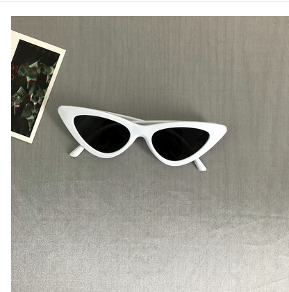 Retro cat-eye sunglasses with a tortoiseshell frame and dark lenses, ideal for a stylish, vintage look. - Image 16