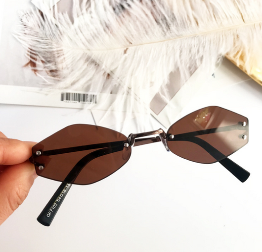 Retro oval vintage sunglasses with orange hexagonal lenses and gold-tone metal temples, held by a hand. - Image 5
